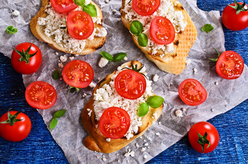 Sandwich with cheese, tomato and Basil