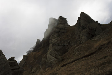 rocks on mountain in cloud