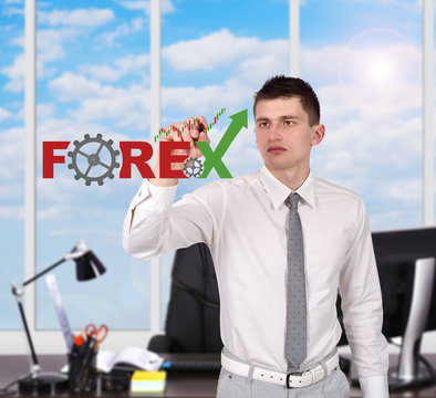 businessman drawing forex symbol