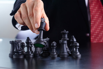 businessman playing chess game