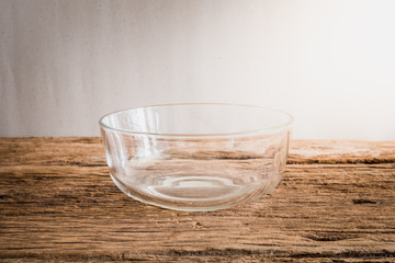 emty glass bowl on wooden tabletop
