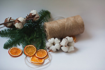 Fototapeta na wymiar Flower design with fluffy dried cotton bolls and jute rope hank 