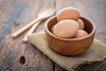 The eggs in wooden bowl