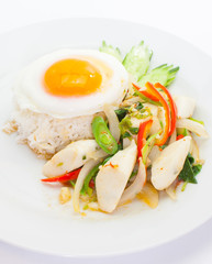 Spicy fried fish ball and seafood with basil leaves