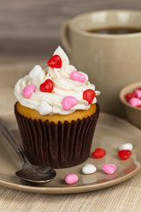 Valentine cupcakes with frosting and hearts. Selective focus.
