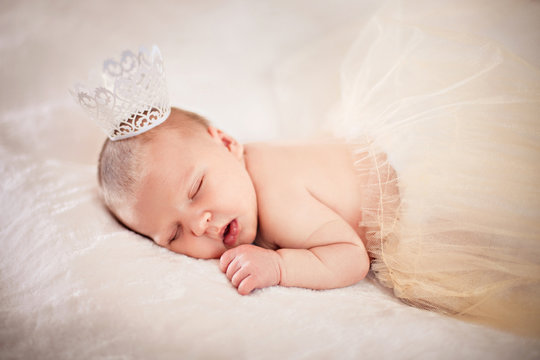 Newborn sleeping princess with crown