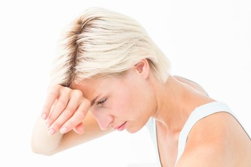 Sad woman crying with hand on forehead