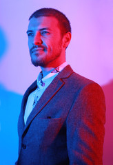 Portrait of handsome casual stylish young man in suit