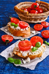 Sandwich with cheese, tomato and Basil