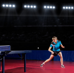 Girl table tennis player at sports hall