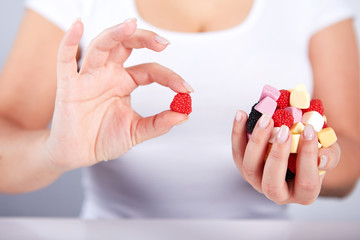 Woman holding a candies
