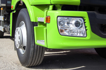 Green truck with big wheels