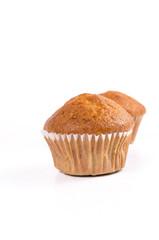Two brown banana muffin in paper cupcake holder isolated on whit