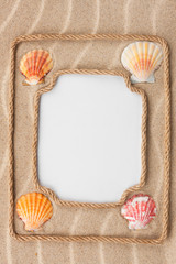 Two beautiful frame made of rope and sea shells with a white bac