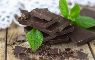 Chocolate and mint on wooden table