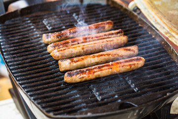 Barbecued beef sausages on grill