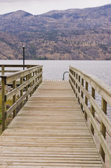 Fototapeta premium Wood walkway to dock on a lake