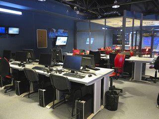 Modern office interior at a television studio with computers and