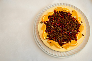 Lemon tart with pomegranate and chocolate chips