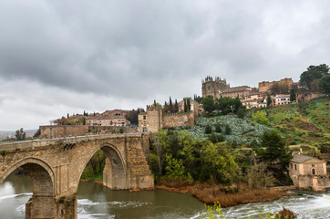 Fototapeta premium San Martin medieval bridge and Monastery in Toledo, Spain