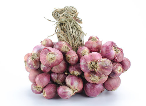 Shallot onions in a group on white background