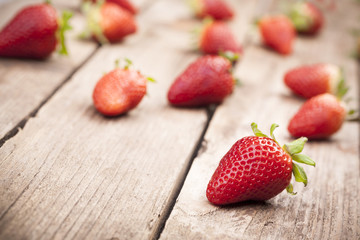 Appetizing strawberries on wooden background