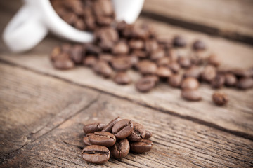 Coffee beans on aged wooden background