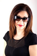 Obraz premium Studio shot of a woman with sunglasses