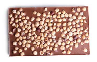 Milk chocolate bar with hazelnuts isolated on white