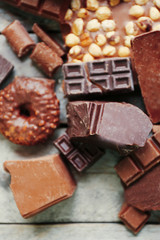 Set of chocolate on wooden table, closeup