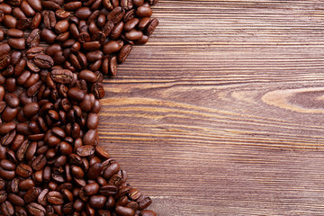 Coffee beans on wooden background
