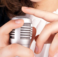Close up of fingers check a microphone