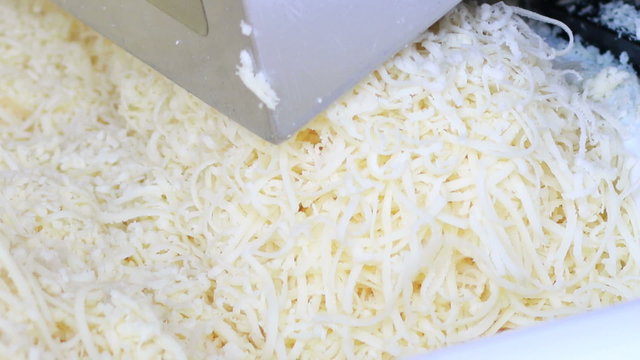 Close up. slice cheese machine