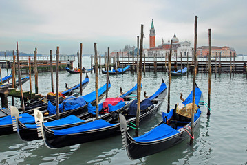 Fototapeta na wymiar Venice, Italy, gondola parking at sun set.