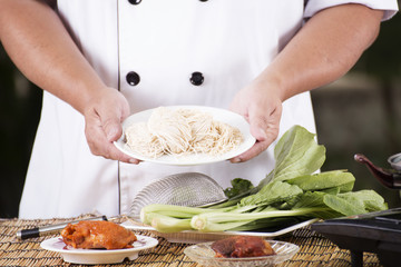 Chef present noodle before cooking