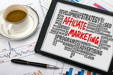 affiliate marketing handwritten on tablet pc with related words