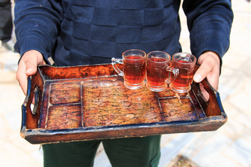 Jordanian man offering tea to the tourists