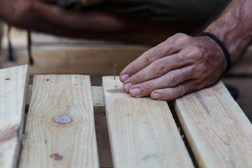 man hand working on wood  -serial-