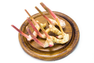 Asia Galangal (Ginger) on Chopping Block isolated
