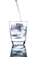 Drinking water is poured into a glass