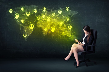 Fototapeta na wymiar Businesswoman in office with tablet and social network world map