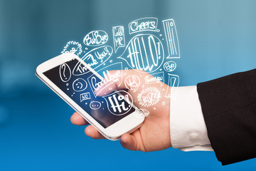 Hand holding phone with hand drawn speech bubbles