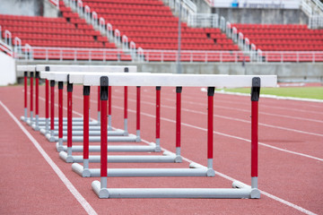 hurdles on the red running track prepared