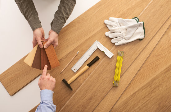 Customer Choosing A Wooden Baseboard