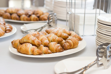 croissant and utensils
