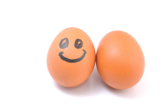 Funny smile egg with plain egg on white background.