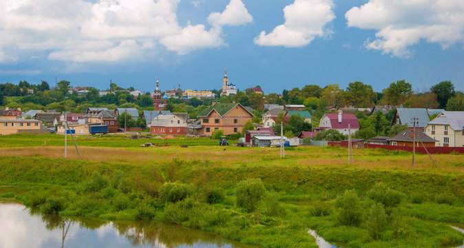 Landscape with ancient Russian city Borovsky, meadow and river