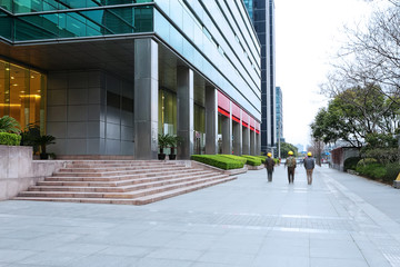 Empty road near modern building exterior