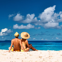 Fototapeta na wymiar Couple on a beach at Seychelles