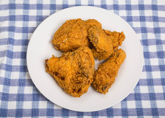 Four Pieces of Fried Chicken on White Plate